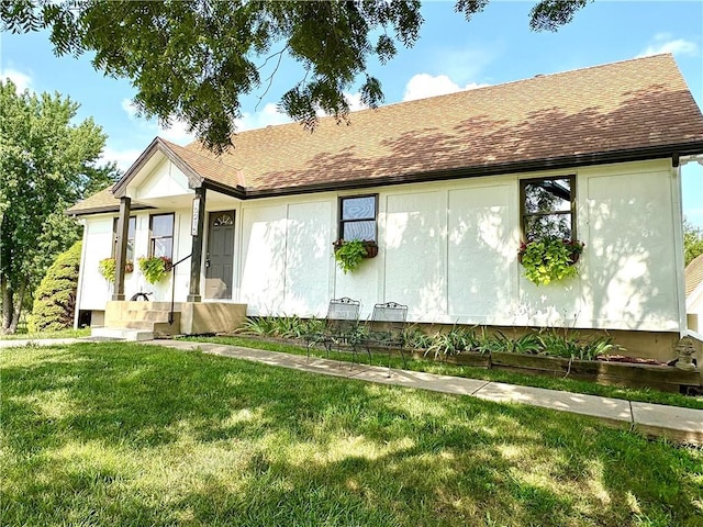 15215 Edgerton Rd, Gardner, KS 66030 - view of front of property with a front yard and a shingled roof