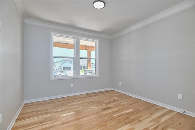 6031 Apache St, Shawnee, KS 66226 - spare room with crown molding, light wood finished floors, and baseboards