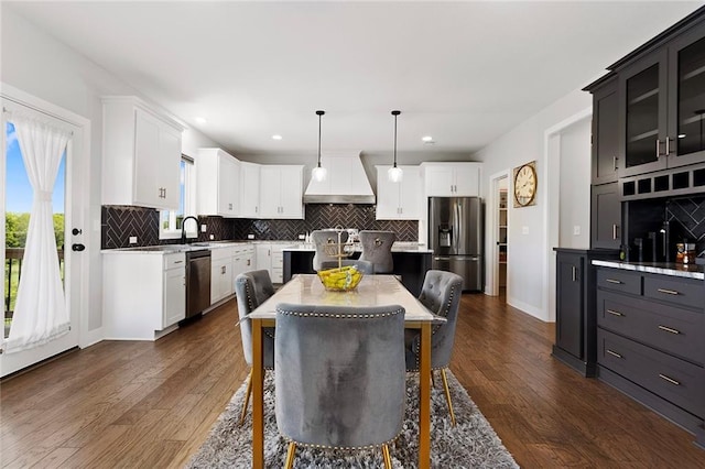4820 NE 90th Ter, Kansas City, MO 64156 - kitchen with stainless steel appliances, premium range hood, decorative backsplash, white cabinetry, and recessed lighting