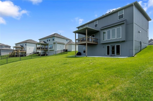4820 NE 90th Ter, Kansas City, MO 64156 - back of house featuring a balcony, a fenced backyard, and a patio area