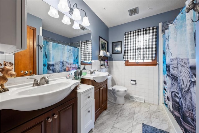 513 Brown Circle Dr, Osawatomie, KS 66064 - bathroom featuring tile walls, vanity, a shower with shower curtain, marble finish flooring, and a chandelier