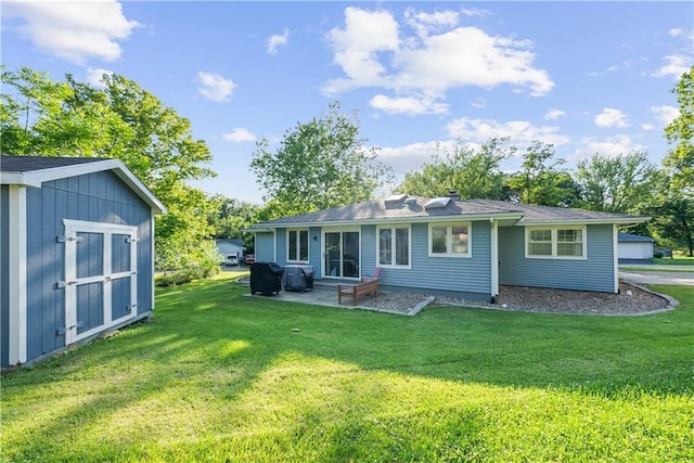 513 Brown Circle Dr, Osawatomie, KS 66064 - rear view of house with a patio area, a lawn, and a storage shed