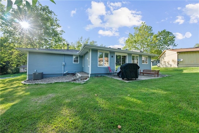 513 Brown Circle Dr, Osawatomie, KS 66064 - rear view of property with a patio and a yard