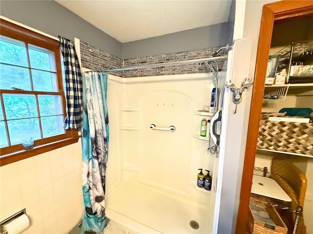 513 Brown Circle Dr, Osawatomie, KS 66064 - bathroom with a stall shower and tile walls