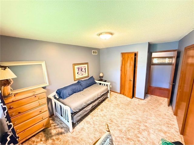 513 Brown Circle Dr, Osawatomie, KS 66064 - carpeted bedroom featuring a textured ceiling