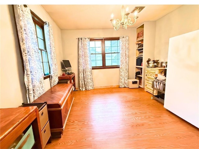 513 Brown Circle Dr, Osawatomie, KS 66064 - office space with a chandelier and light wood finished floors