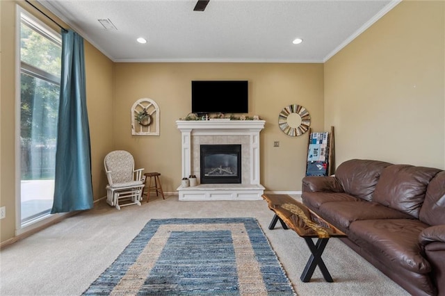 2436 SW Current Ln, Lees Summit, MO 64082 - living room featuring carpet, ornamental molding, a tiled fireplace, and recessed lighting