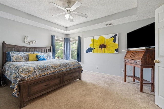 2436 SW Current Ln, Lees Summit, MO 64082 - bedroom with light colored carpet, a raised ceiling, a textured ceiling, and a ceiling fan