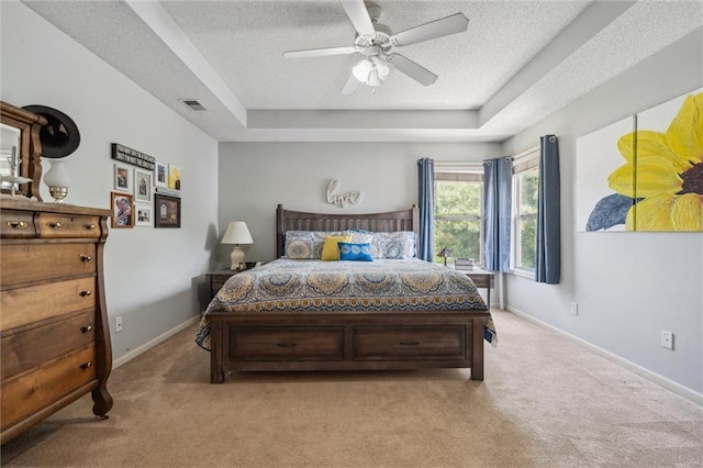 2436 SW Current Ln, Lees Summit, MO 64082 - bedroom with light carpet, a raised ceiling, a textured ceiling, and ceiling fan