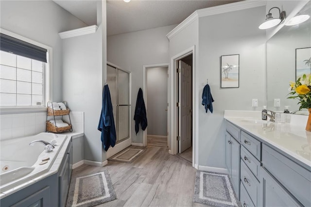 2436 SW Current Ln, Lees Summit, MO 64082 - full bath featuring vanity, wood finished floors, a whirlpool tub, and a shower with door