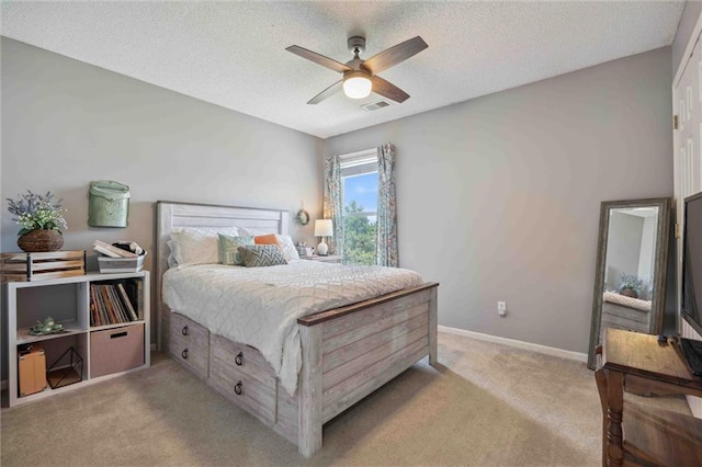 2436 SW Current Ln, Lees Summit, MO 64082 - bedroom with light colored carpet, a textured ceiling, and a ceiling fan