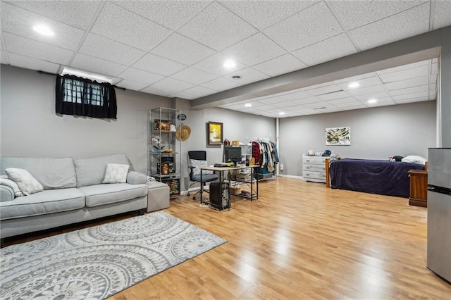 2436 SW Current Ln, Lees Summit, MO 64082 - living area with wood finished floors, a paneled ceiling, and recessed lighting