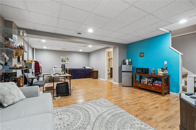 2436 SW Current Ln, Lees Summit, MO 64082 - living room featuring wood finished floors, a paneled ceiling, recessed lighting, and stairway