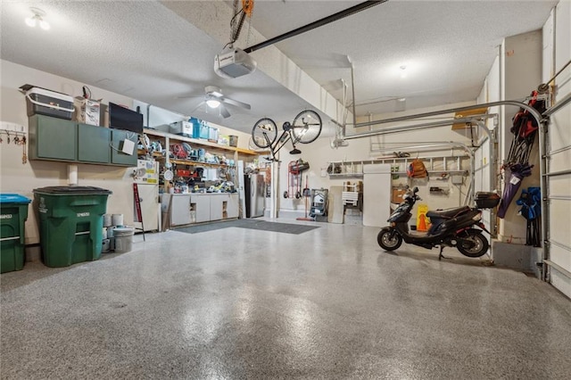 2436 SW Current Ln, Lees Summit, MO 64082 - garage featuring a garage door opener and a ceiling fan