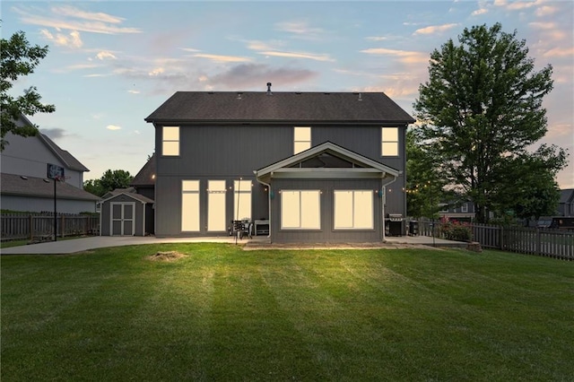 2436 SW Current Ln, Lees Summit, MO 64082 - back of house with a storage unit, a fenced backyard, and a patio