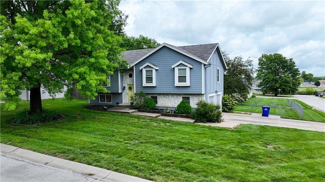 1453 Madison St, Lees Summit, MO 64081 - raised ranch with driveway and an attached garage