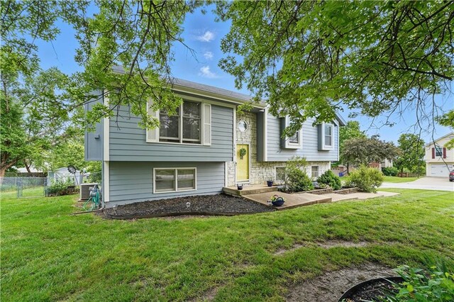 1453 Madison St, Lees Summit, MO 64081 - bi-level home featuring central air condition unit