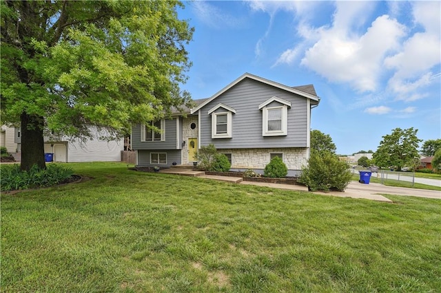 1453 Madison St, Lees Summit, MO 64081 - raised ranch with a front yard