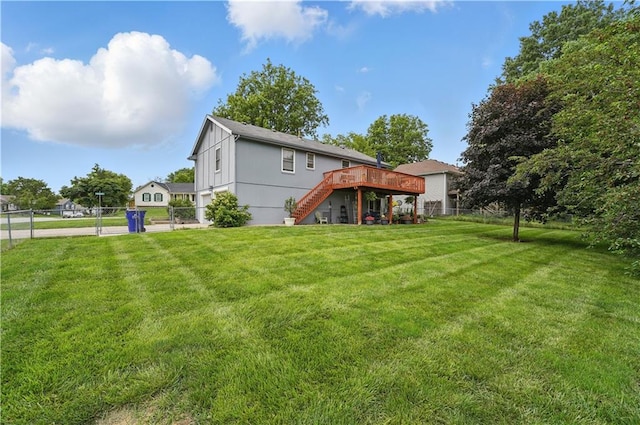 1453 Madison St, Lees Summit, MO 64081 - back of house with stairway, a wooden deck, and a gate