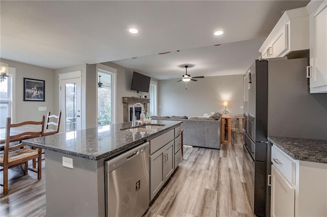 807 N Whispering Hills Dr, Lone Jack, MO 64070 - kitchen with stainless steel appliances, a sink, open floor plan, healthy amount of natural light, and recessed lighting