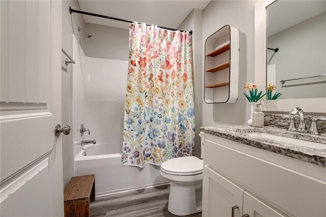 807 N Whispering Hills Dr, Lone Jack, MO 64070 - full bathroom with wood finished floors, vanity, toilet, and shower / tub combo with curtain