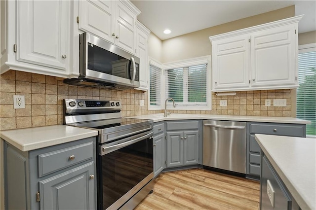 4904 W 162nd St, Overland Park, KS 66085 - kitchen featuring gray cabinetry, appliances with stainless steel finishes, a sink, white cabinets, and recessed lighting