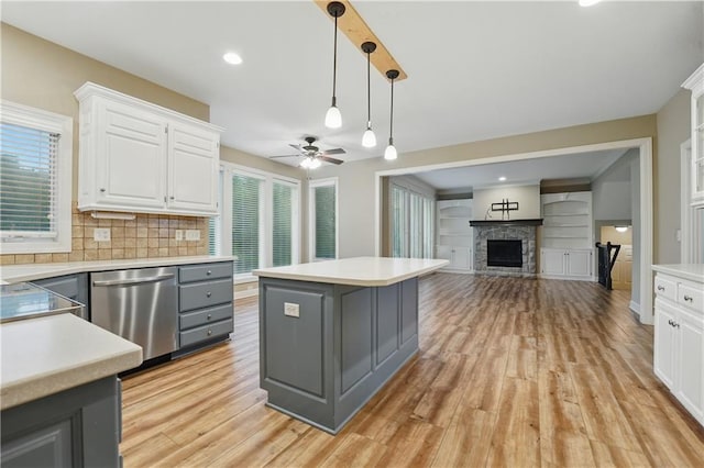 4904 W 162nd St, Overland Park, KS 66085 - kitchen with stainless steel dishwasher, gray cabinets, white cabinetry, and light countertops