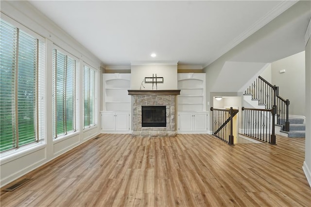 4904 W 162nd St, Overland Park, KS 66085 - unfurnished living room with light wood finished floors, baseboards, a fireplace, ornamental molding, and recessed lighting