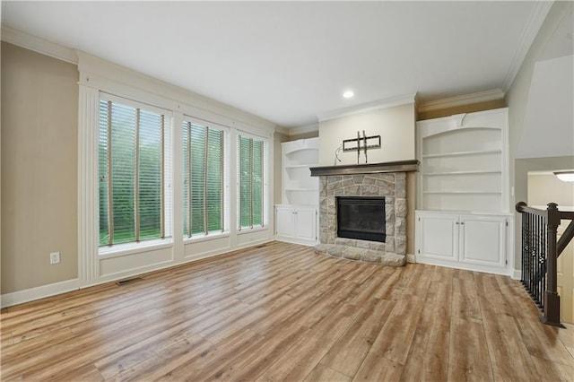4904 W 162nd St, Overland Park, KS 66085 - unfurnished living room with ornamental molding, light wood-style flooring, a fireplace, baseboards, and built in features