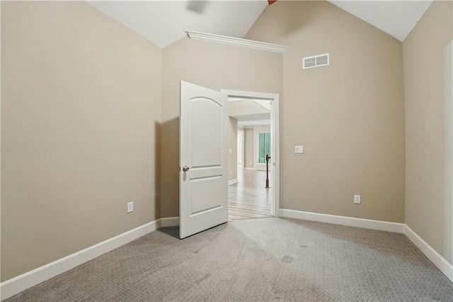 4904 W 162nd St, Overland Park, KS 66085 - unfurnished bedroom with light colored carpet, baseboards, high vaulted ceiling, and a ceiling fan