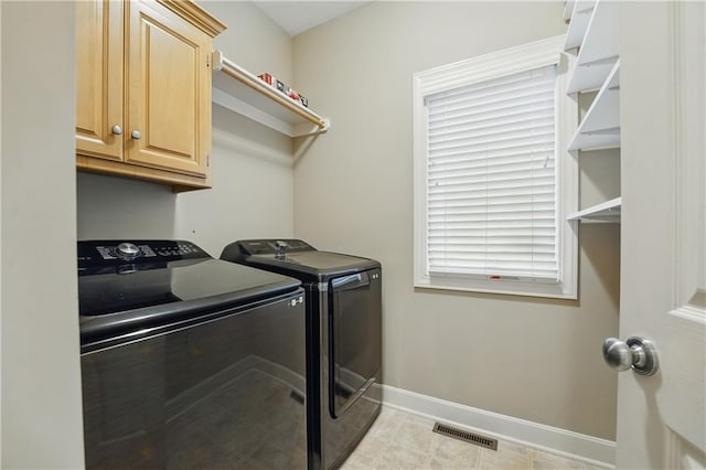 4904 W 162nd St, Overland Park, KS 66085 - laundry area with washer and dryer, baseboards, and cabinet space