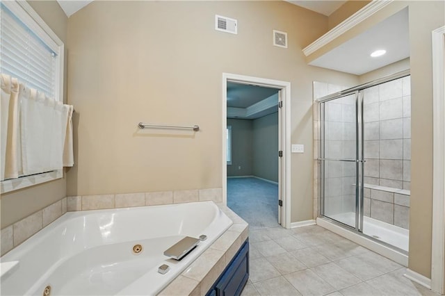 4904 W 162nd St, Overland Park, KS 66085 - bathroom with a tub with jets, a stall shower, baseboards, tile patterned flooring, and healthy amount of natural light
