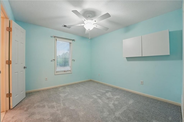 4904 W 162nd St, Overland Park, KS 66085 - spare room with light carpet, ceiling fan, baseboards, and a textured ceiling