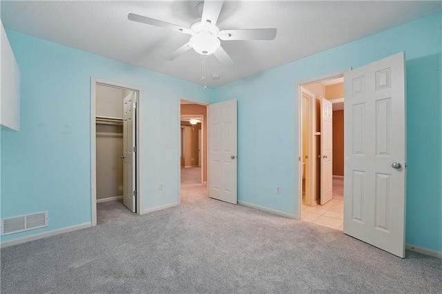 4904 W 162nd St, Overland Park, KS 66085 - unfurnished bedroom with carpet, a spacious closet, baseboards, and a ceiling fan