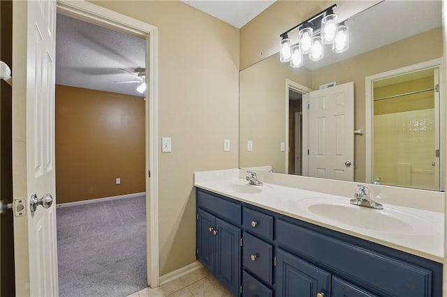 4904 W 162nd St, Overland Park, KS 66085 - full bath featuring double vanity, baseboards, ceiling fan, and tile patterned flooring