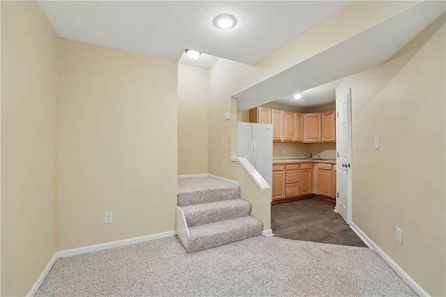 4904 W 162nd St, Overland Park, KS 66085 - kitchen with dark carpet, baseboards, a sink, and light countertops