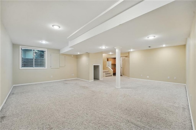 4904 W 162nd St, Overland Park, KS 66085 - finished below grade area featuring stairs, baseboards, and light carpet