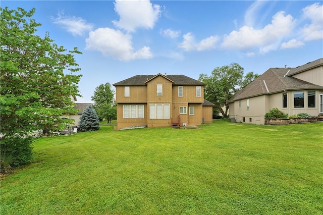 4904 W 162nd St, Overland Park, KS 66085 - back of house featuring a lawn and stucco siding