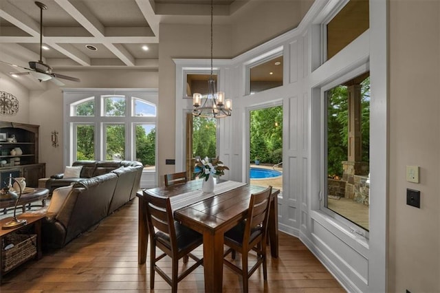 11121 S Whitetail Ln, Olathe, KS 66061 - dining room with coffered ceiling, wood-type flooring, beam ceiling, ceiling fan, and a chandelier