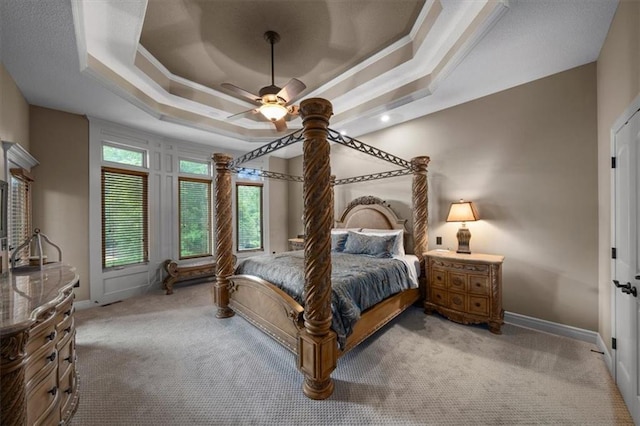 11121 S Whitetail Ln, Olathe, KS 66061 - bedroom featuring light colored carpet, a ceiling fan, a tray ceiling, and ornamental molding