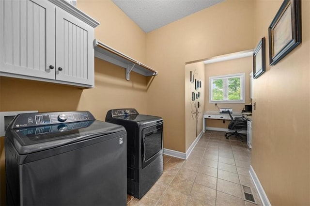 11121 S Whitetail Ln, Olathe, KS 66061 - washroom featuring cabinet space, washing machine and clothes dryer, a desk, and light tile patterned floors