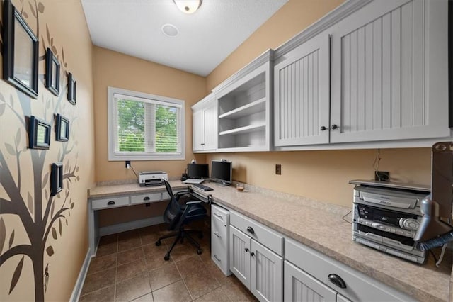 11121 S Whitetail Ln, Olathe, KS 66061 - office space with built in study area and dark tile patterned flooring