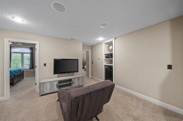 11121 S Whitetail Ln, Olathe, KS 66061 - carpeted living room with baseboards and a textured ceiling