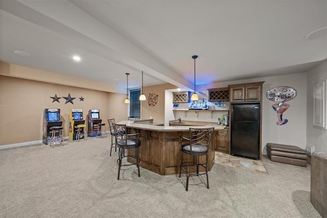 11121 S Whitetail Ln, Olathe, KS 66061 - indoor wet bar featuring freestanding refrigerator, light colored carpet, and pendant lighting