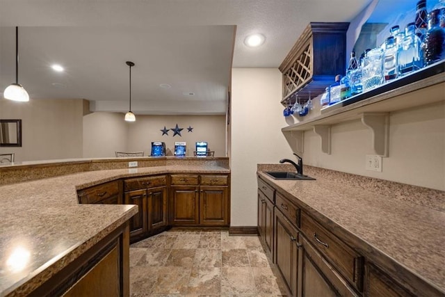 11121 S Whitetail Ln, Olathe, KS 66061 - kitchen with pendant lighting, open shelves, light stone finish floors, recessed lighting, and light countertops