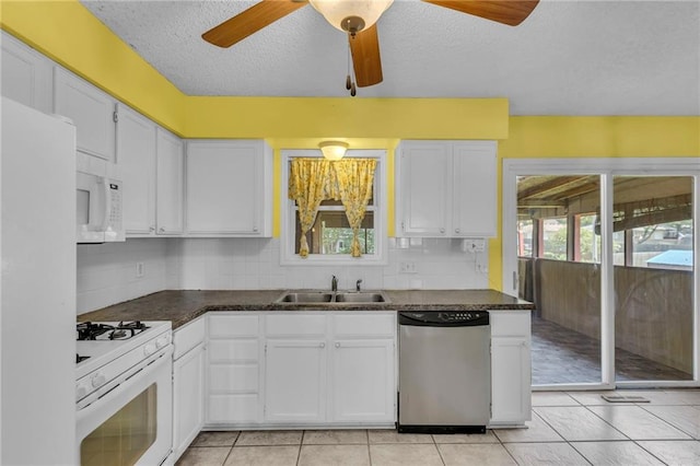 531 S Oak St, Gardner, KS 66030 - kitchen with white appliances, a sink, a textured ceiling, a ceiling fan, and dark countertops