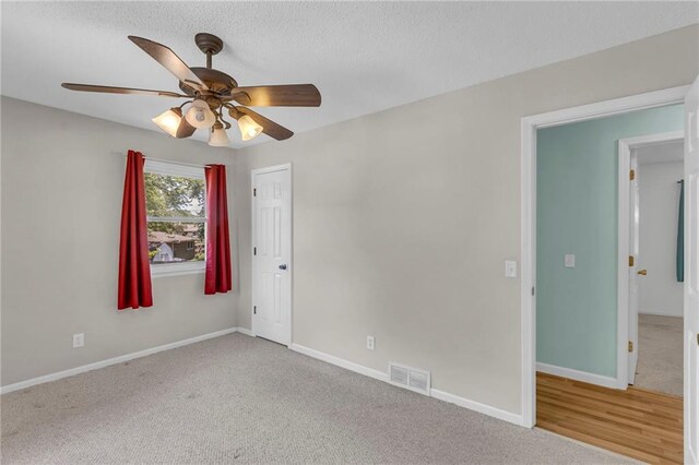 531 S Oak St, Gardner, KS 66030 - empty room with ceiling fan, carpet floors, baseboards, and a textured ceiling