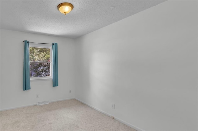 531 S Oak St, Gardner, KS 66030 - empty room with a textured ceiling, carpet flooring, and baseboards