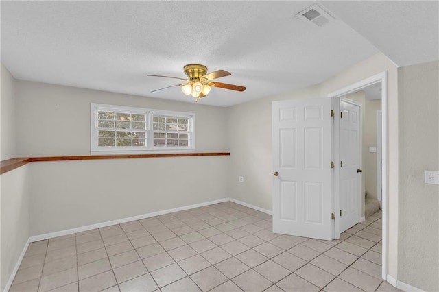 531 S Oak St, Gardner, KS 66030 - spare room featuring a ceiling fan, light tile patterned floors, and baseboards