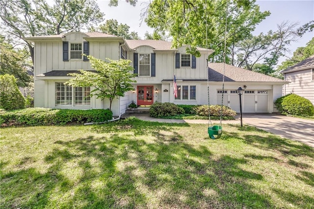 8911 W 105th Ter, Overland Park, KS 66212 - traditional-style house with board and batten siding, an attached garage, concrete driveway, and a front lawn